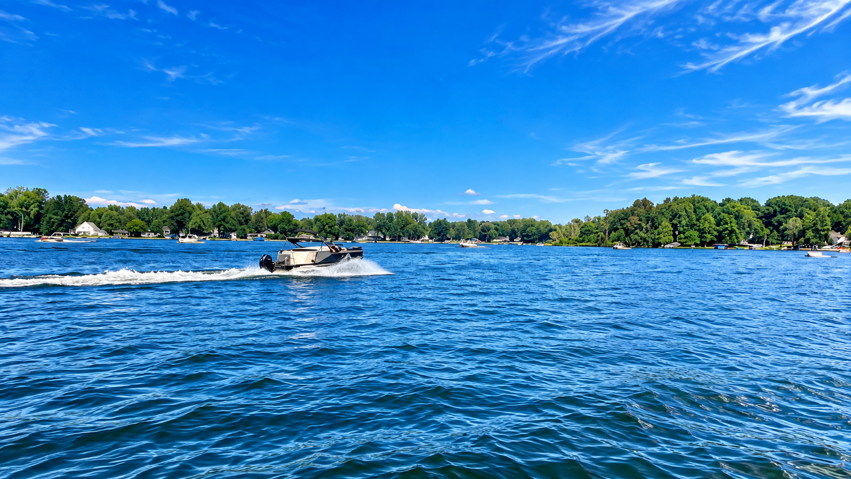 Sunny Lake Day with Speeding Motorboat